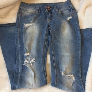 Mid rise ripped bootcut jeans